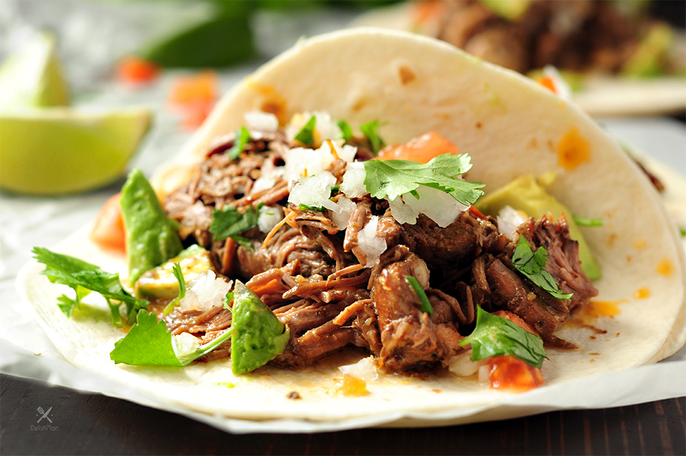 Tender shredded beef barbacoa with lime and cilantro