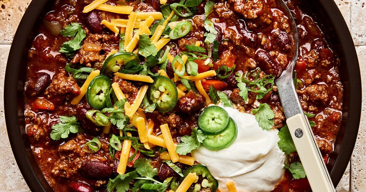 Rich beef chili topped with cheddar, jalapeño, cilantro, green onion, and sour cream