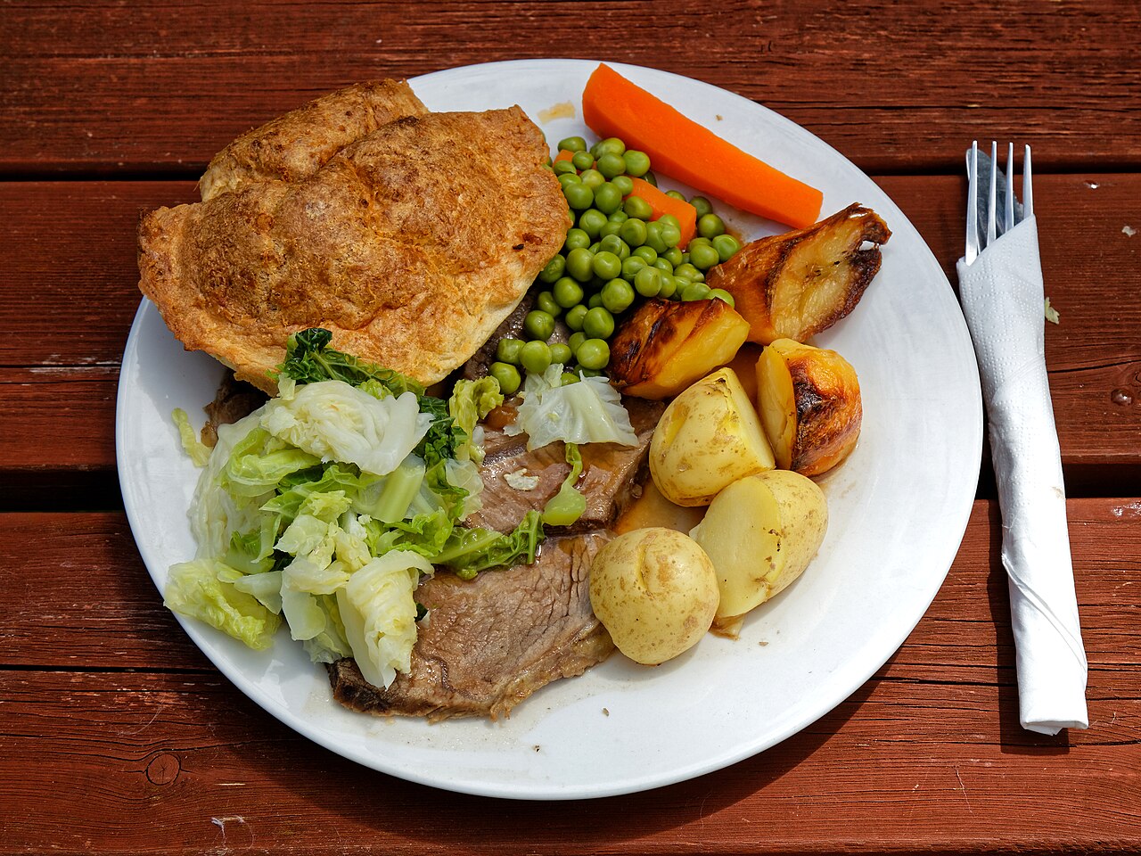 Slow-cooked roast beef dinner with vegetables